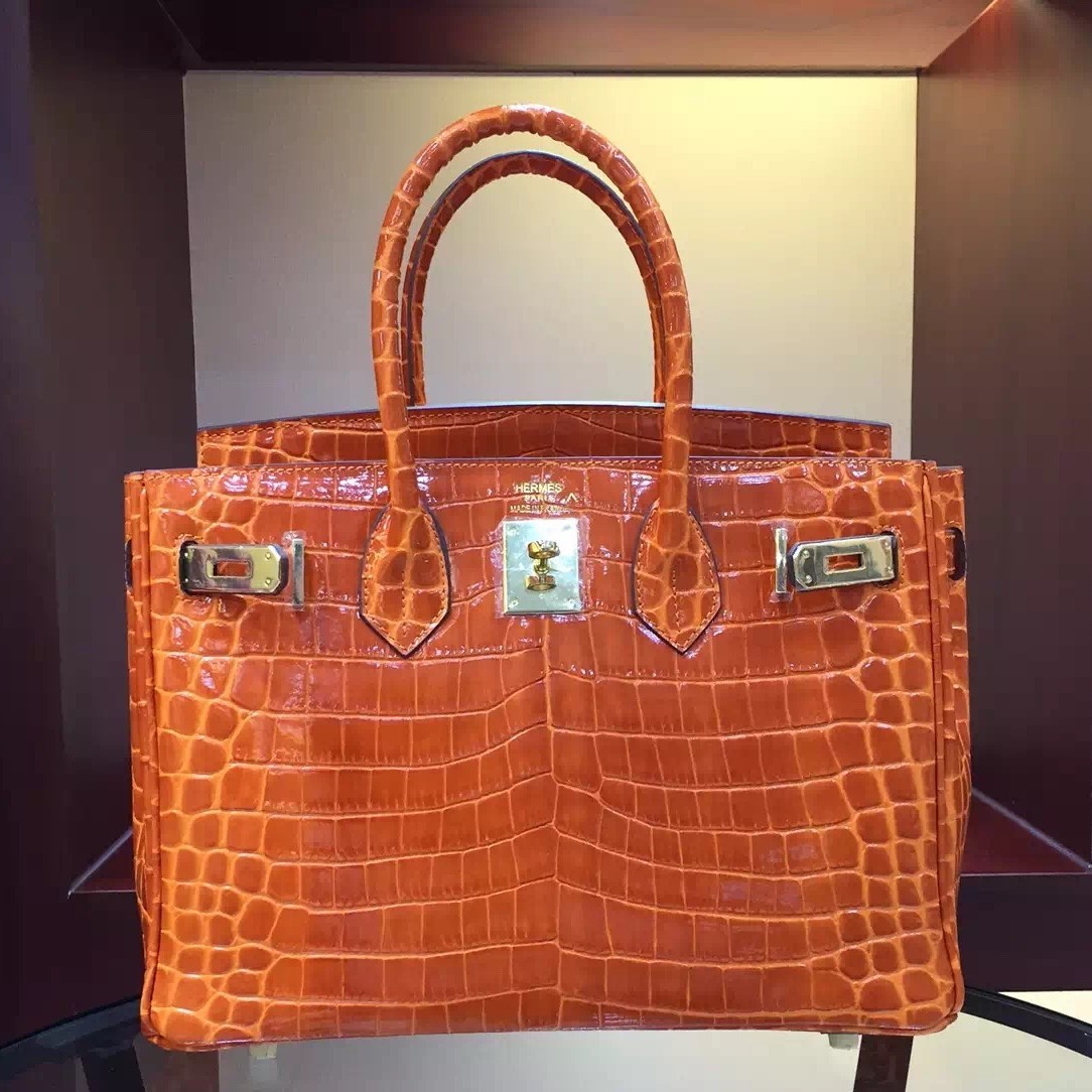 AN ORANGE CROCODILE 'BIRKIN' BAG